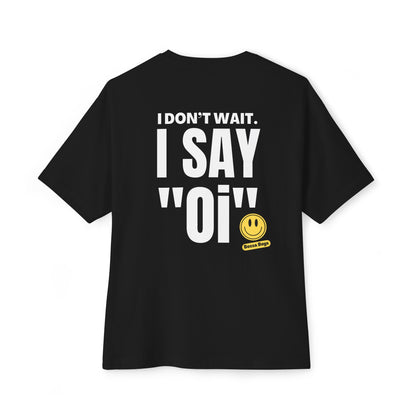 Black oversized tee with 'I DON'T WAIT. I SAY 'OI'' text and a smiley face